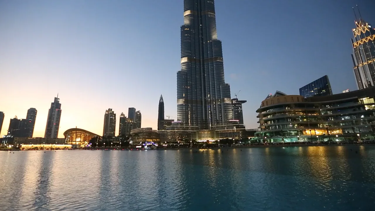 Burj Khalifa over the Dubai fountain lake at dusk