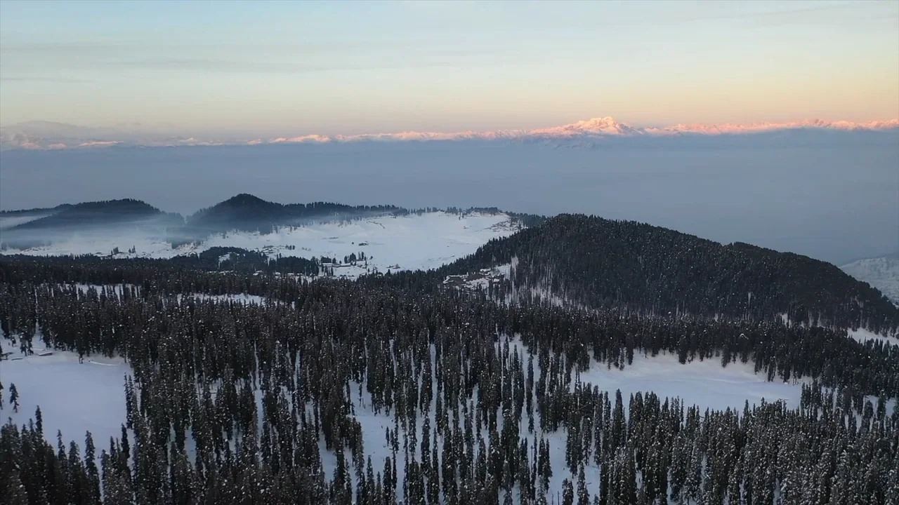 Snow-covered Himalayan ridge at first light